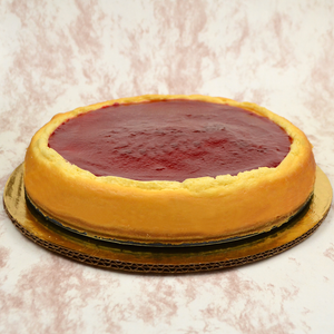 Cheesecake con coulis de frambuesa